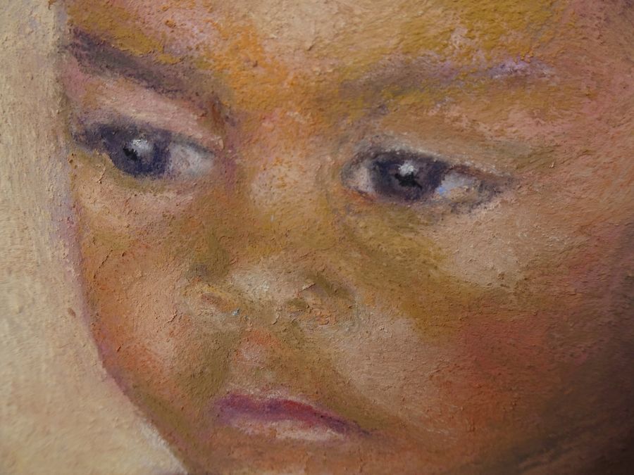 Indigenous boy painting- close up of eyes